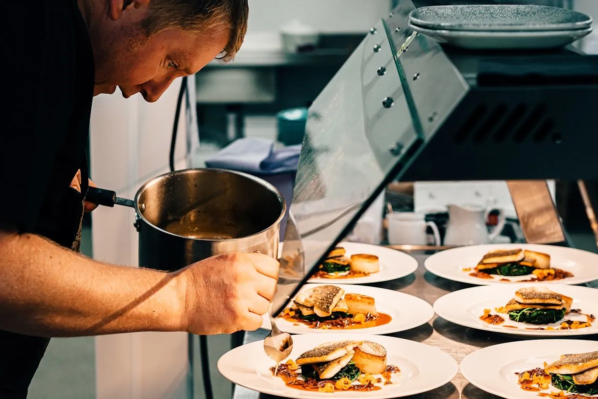 Chef preparing food in a professional restaurant kitchen