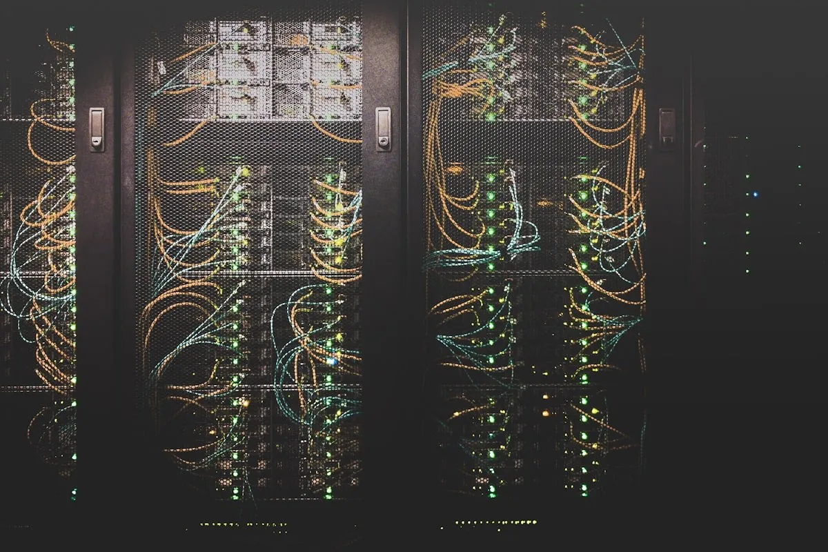Network operations centre with monitoring dashboards on multiple screens